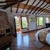 Casa de Campo Hotel & Spa in Villa de Leyva: rustic suite with king bed, fireplace, and balcony view