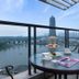 Balcony with tea table and city view at Hangzhou Blossom Water Museum Hotel in Hangzhou