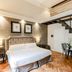 Relais Tosinghi Florence loft-style guest room with mezzanine staircase and king bed