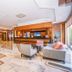 Anemon Ege Hotel in Izmir lobby with reception desk, seating area, and elevator