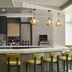 Hilton Garden Inn Tampa-East/Brandon bar with stools, pendant lights and TV in Tampa