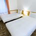 Toyoko Inn Gumma Isesaki Ekimae room with two twin beds and window in Isesaki