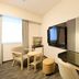 Richmond Hotel Tokyo Suidobashi guest room with desk, TV, chairs, and window in Tokyo