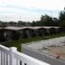 Nader's Motel & Suites in Ludington, outdoor pool with lounge chairs and row of suites