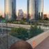 Hotel Los Españoles Plus rooftop pool with city skyline views in Santiago