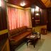 Hotel City Tower Coimbatore lounge with brown sofa, coffee table and wood-paneled interior