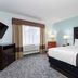 La Quinta Inn & Suites by Wyndham Bonita Springs Naples N. guest room with king bed and window