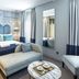 The Lift Boutique Hotel by Ridan Hotels Lisbon room with bed, chaise lounge and patterned headboard