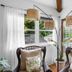 Mar Bella Boutique Hotel & Spa in Rehoboth Beach, sunlit corner with wicker chairs and garden view