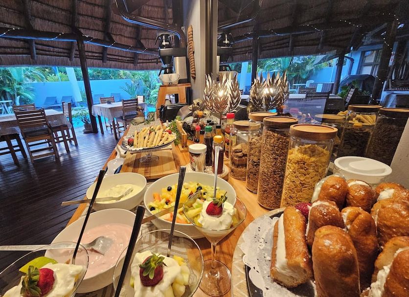 Leopard Corner Lodge, Saint Lucia buffet breakfast spread in an open-air dining area