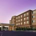 Courtyard by Marriott San Antonio Lackland exterior with covered entrance and purple sky