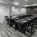 City Express by Marriott Oaxaca meeting room with U-shaped conference table, black chairs, and flip chart