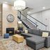 Country Inn & Suites by Radisson, Merrillville, IN lobby with fireplace, sectional sofa, and staircase