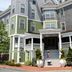 The Nantucket Hotel & Resort in Nantucket, exterior with flag, porch, and green-gray facade
