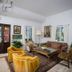 La Casa del Camino lobby in Laguna Beach with seating area, wood table, chairs, and potted plants