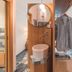 Médousa Suites Taormina suite interior with circular mirror, sink, and open clothing rack