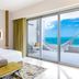 Garza Blanca Resort & Spa Cancun guest room with ocean-view balcony and hammock in Cancún.