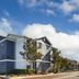 Homewood Suites by Hilton Fresno exterior with blue sky and landscaped grounds