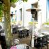 Les Bords de Seine in La Roche-Guyon outdoor terrace with café tables and heaters