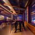 Hotel Grand Palace in Chennai rooftop bar with high stools and city lights at night