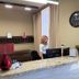 Yerevan Deluxe Hotel reception desk in Yerevan with front desk, clock, lamp and lobby seating