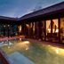 Ho Tram Beach Boutique Resort & Spa in Ba Ria with a lit courtyard plunge pool at dusk
