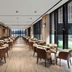 Courtyard by Marriott Shanghai International Tourism and Resorts Zone restaurant with long dining room and large windows