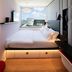citizenM Miami World Center room with bed beside a large window overlooking Miami skyline