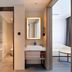Hanting Hotel Zibo Jinjing Avenue Municipal Government bathroom vanity and bedroom entry in Zibo