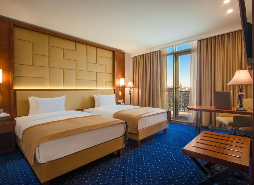 New Tiflis Hotel Tbilisi guest room with two twin beds and balcony view