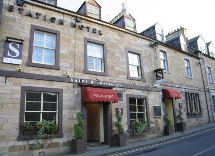Station Hotel And Restaurant in Melrose, stone facade with restaurant entrance and street view