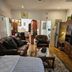 The Royal Princess Garden - Randburg room with leather sofas, coffee table, and wooden cabinets