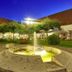 Schloss Reinach in Freiburg im Breisgau courtyard with illuminated fountain at dusk