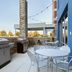 Home2 Suites by Hilton Florence outdoor patio with grill and tables