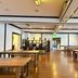 Active Life Madarao in Iiyama: spacious dining hall with wooden tables and polished floor