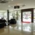 Jb City Hotel Johor Bahru lobby with black seating, glass entrance, and polished tile floor