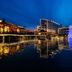 Xiang Ming Luxury Airport Hotel in Huangshan at dusk beside a lit waterfront with fountain reflections