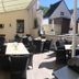 Hotel Pension Dorfschänke in Klotten with covered terrace seating and outdoor tables