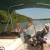 Guests ride a boat on the water at Hotel Cocomar Beachfront Hotel in Parrita