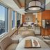 Mandarin Oriental, Tokyo suite with panoramic city views, seating area, and wooden wall panels