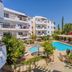 Artemis Cynthia Complex in Paphos with outdoor pool, sun loungers, and landscaped gardens