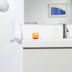 Dye House Providence bathroom sink with mirror, wall sconce, towel and framed artwork