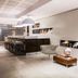 The Caesar Roma in Rome lounge with bar stools, modern chairs and display shelves