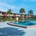 Red Roof Inn Vero Beach - I-95 pool with palm trees and motel-style exterior in Vero Beach