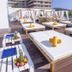 Hotel Alhambra in Santa Susanna rooftop terrace with sun loungers and cabana daybeds