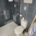 Hotel Amerique in Palavas-les-Flots bathroom with walk-in shower, toilet and small window