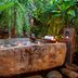 Lynnaya Urban River Resort in Siem Reap, tropical stone soaking pool surrounded by lush greenery