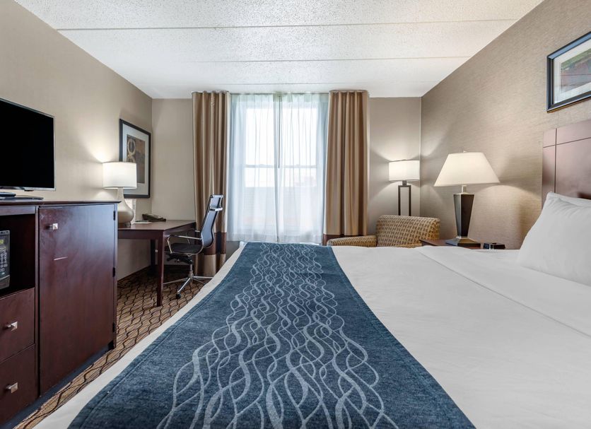 Comfort Inn & Suites Glen Mills - West Chester guest room with king bed, desk, TV and window seating