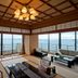 Hotel Biwanso in Nanao with tatami room, ocean-view windows, and seating area