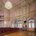 Priska Heritage Rooms Split grand chandelier event hall with ornate gilded ceilings and rows of red chairs